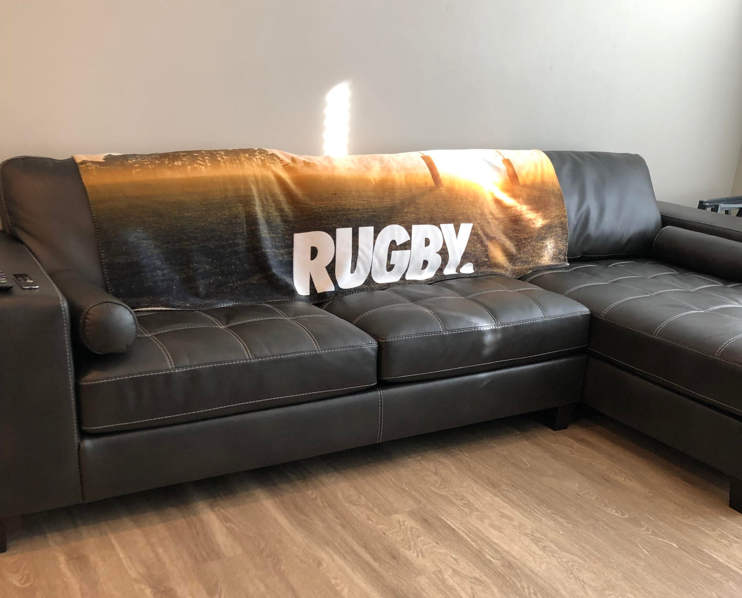 rugby hooded blanket on couch